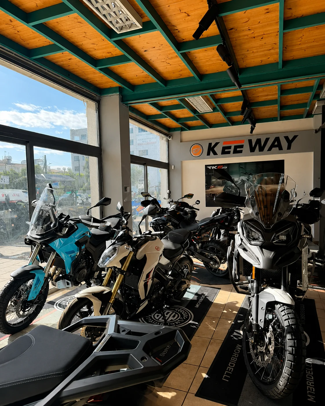 Red Baron showroom with motorcycles displayed inside the Keeway showroom